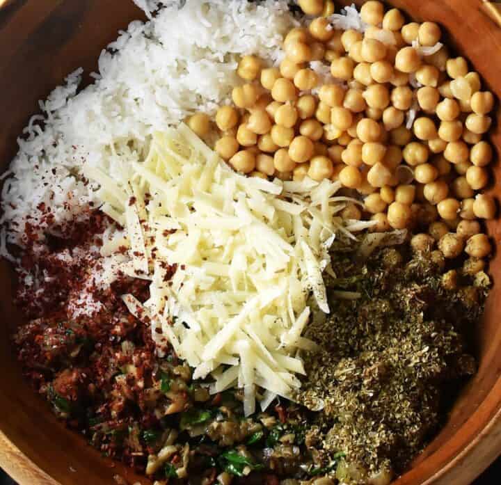 Components of chickpea filling mixture for peppers in large bowl.