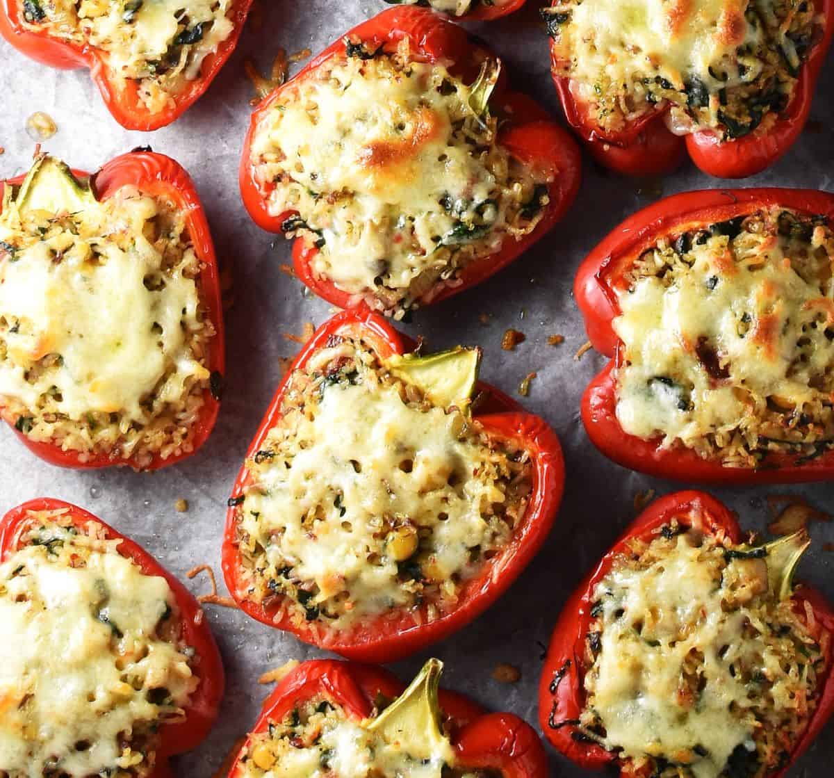 Top down view of baked stuffed red peppers with chickpeas and cheese.