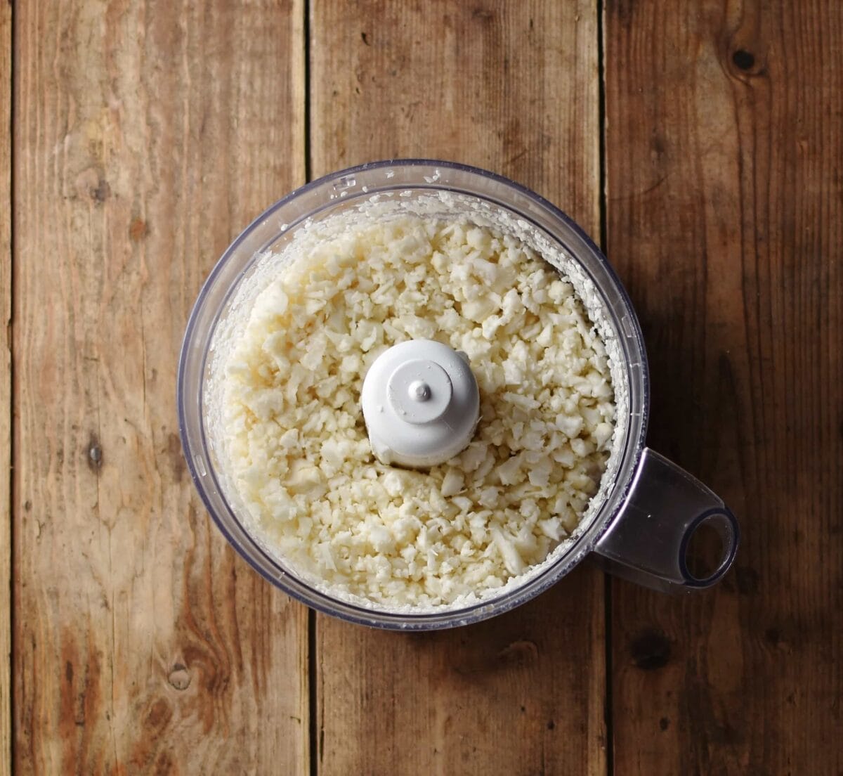 Cauliflower rice inside small blender.