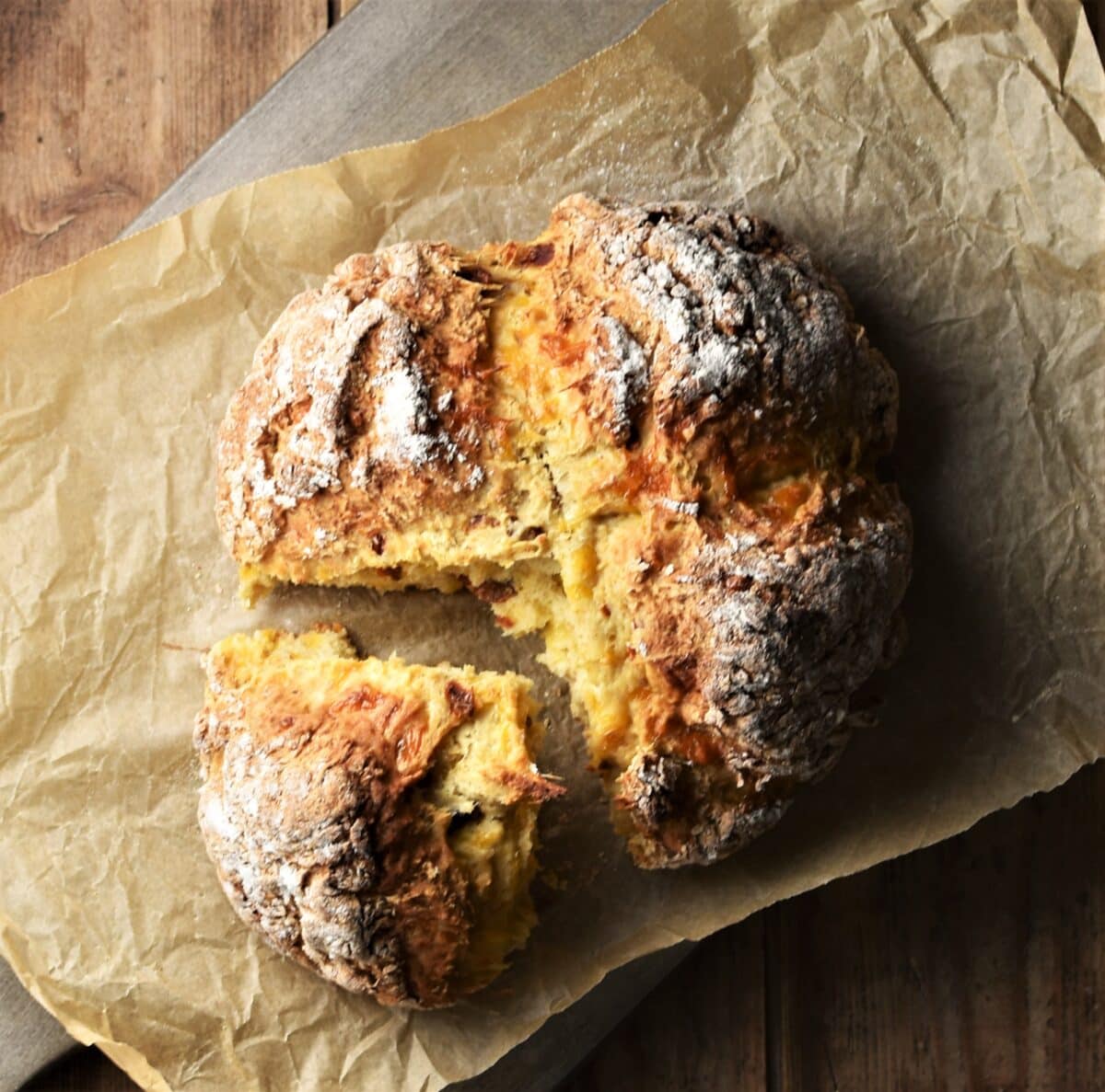 Top down view of sun dried tomato bread on parchment.