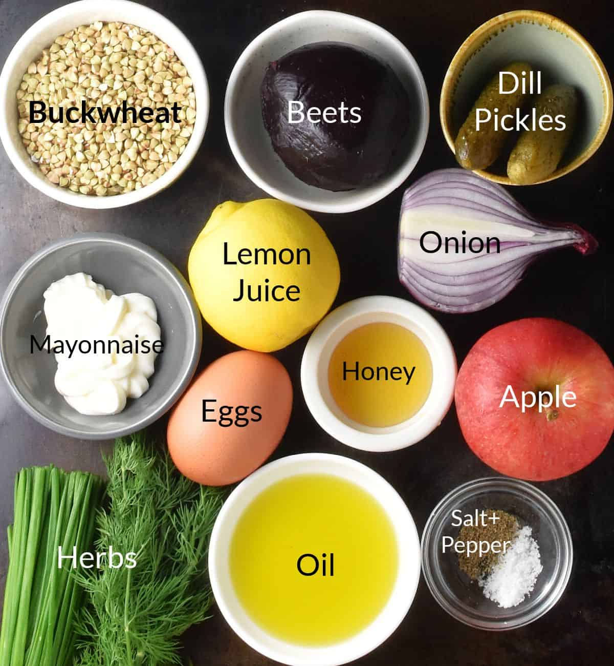 Top down view of ingredients for buckwheat salad in individual dishes.
