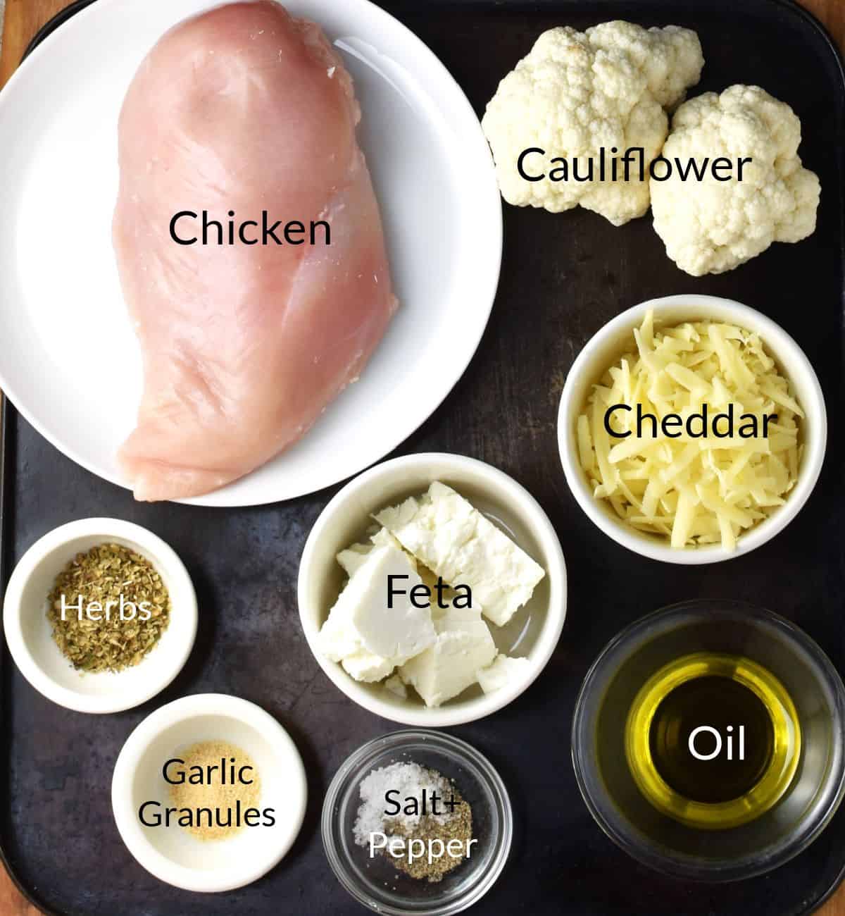 Ingredients for making cauliflower crusted chicken in individual dishes.