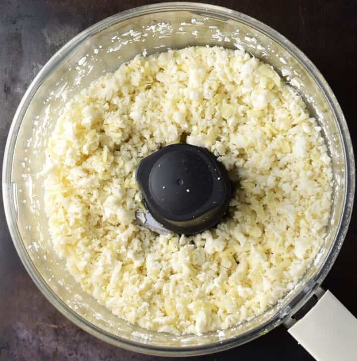 Top down view of cauliflower crust mixture in blender.