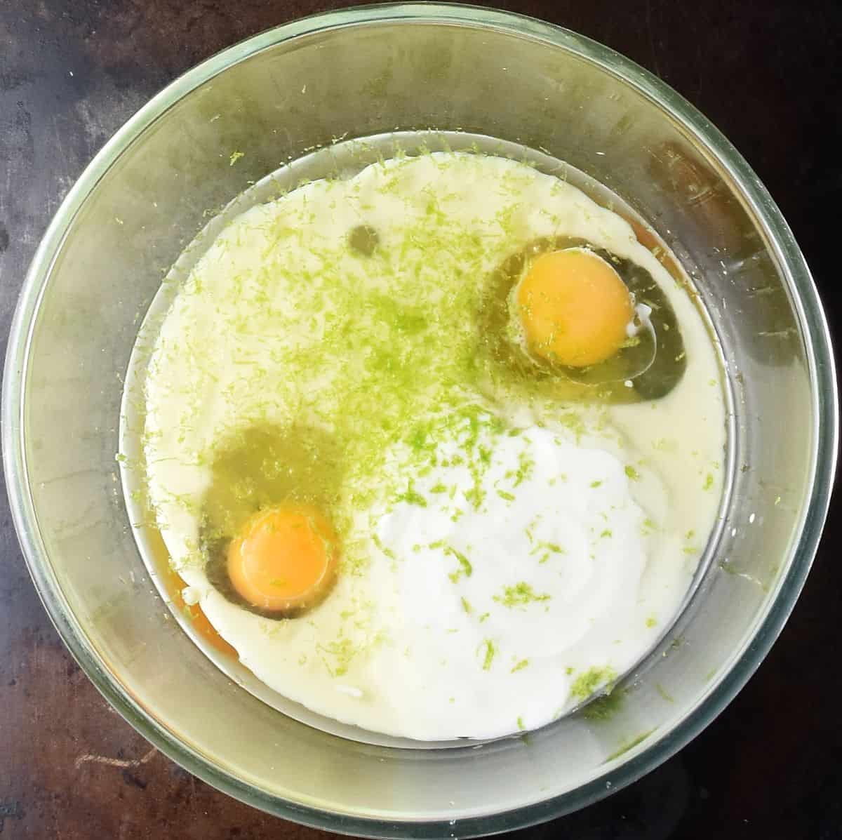 2 eggs, buttermilk and lime zest in large glass bowl.