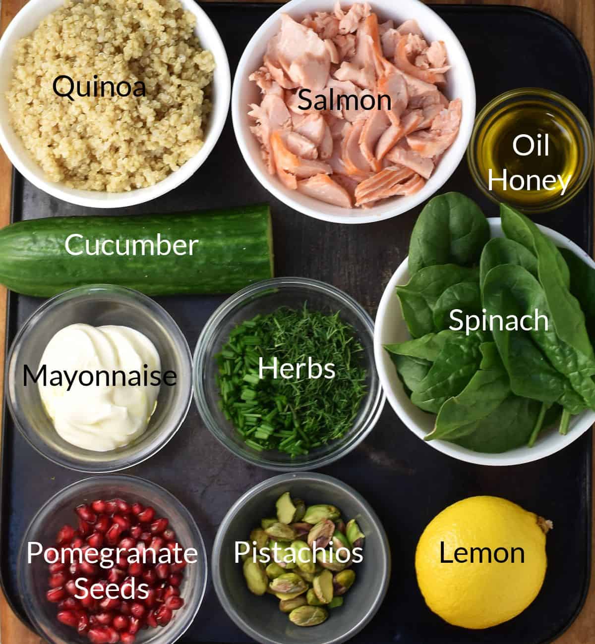 Ingredients for making salmon quinoa salad in individual dishes.