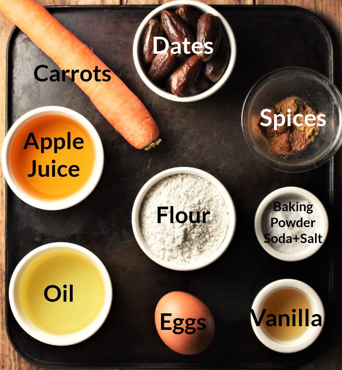 Ingredients for making carrot muffins with dates in individual dishes.