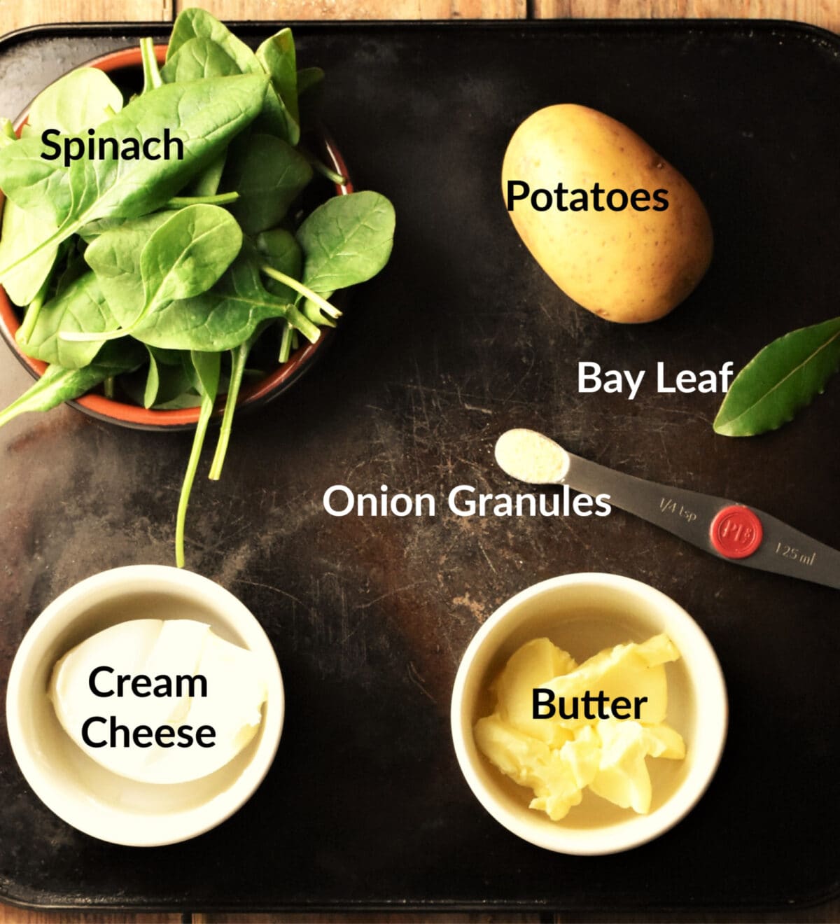 Spinach mashed potato ingredients in separate dishes.