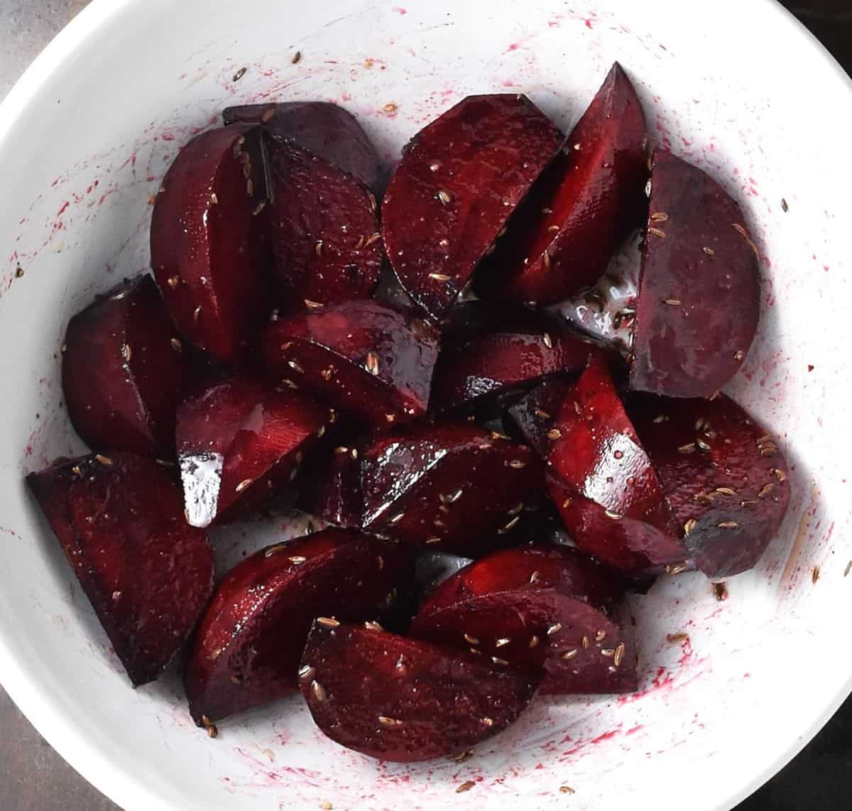 Beet wedges in white bowl.