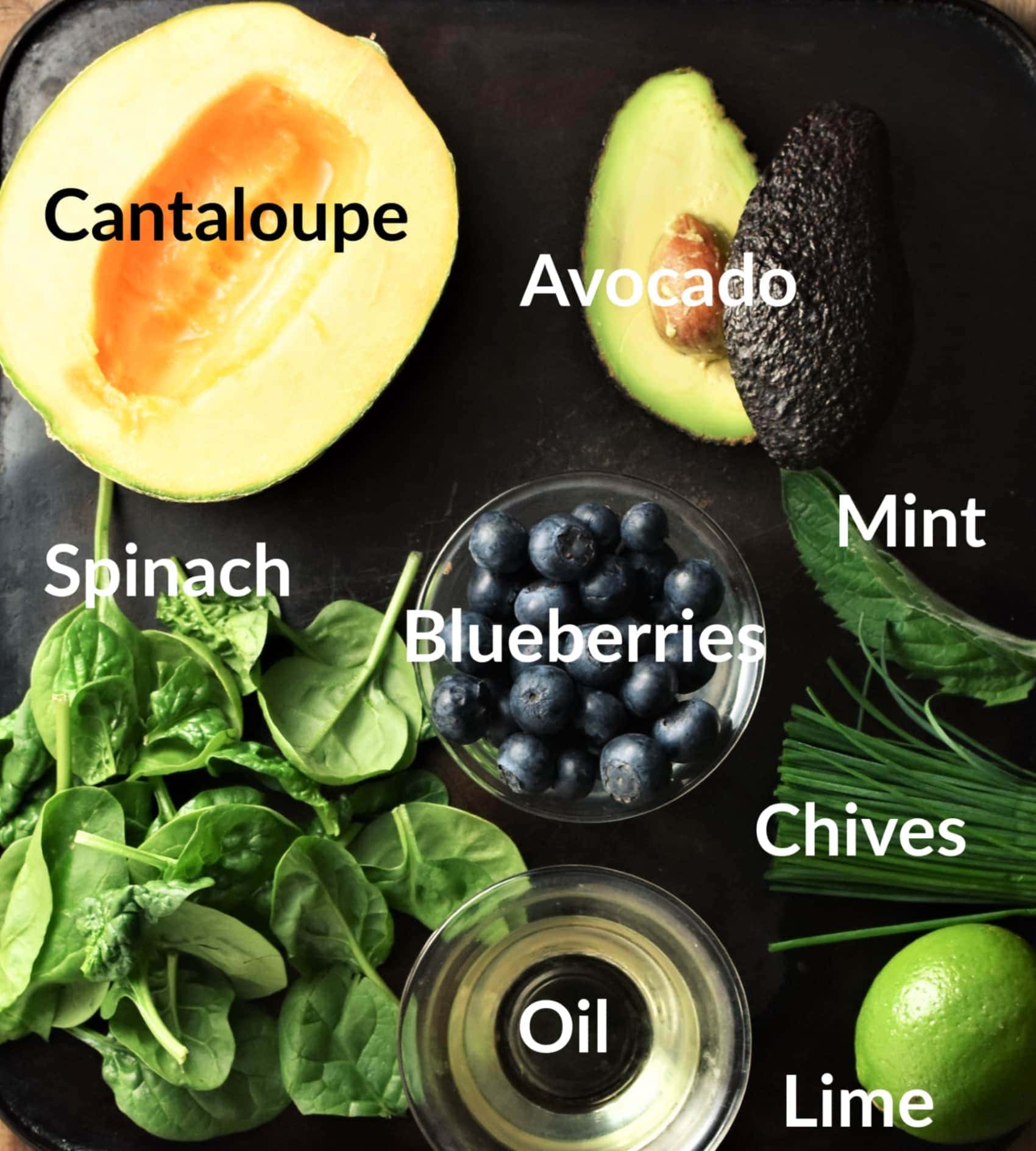 Cantaloupe salad ingredients in individual dishes.