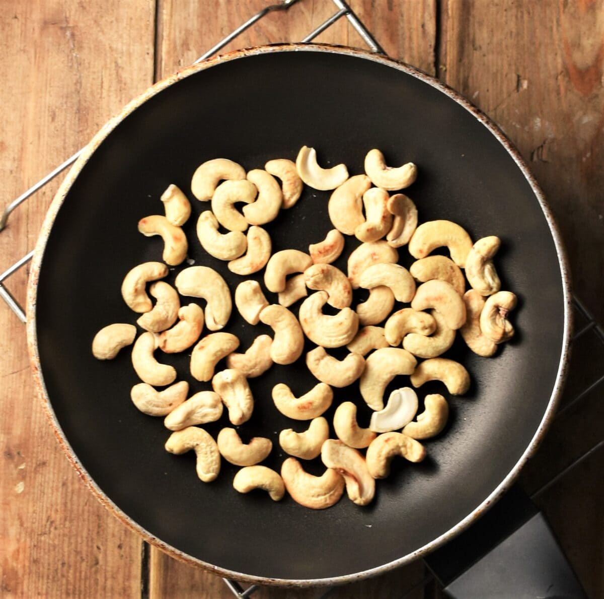 Top down view of cashews in pan.