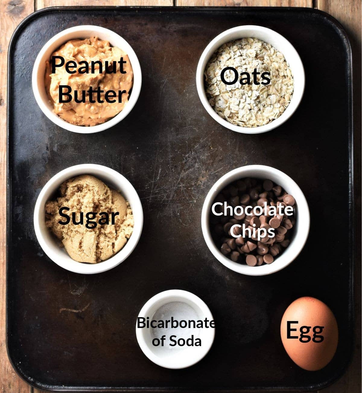 Peanut butter oat cookies ingredients in individual dishes.
