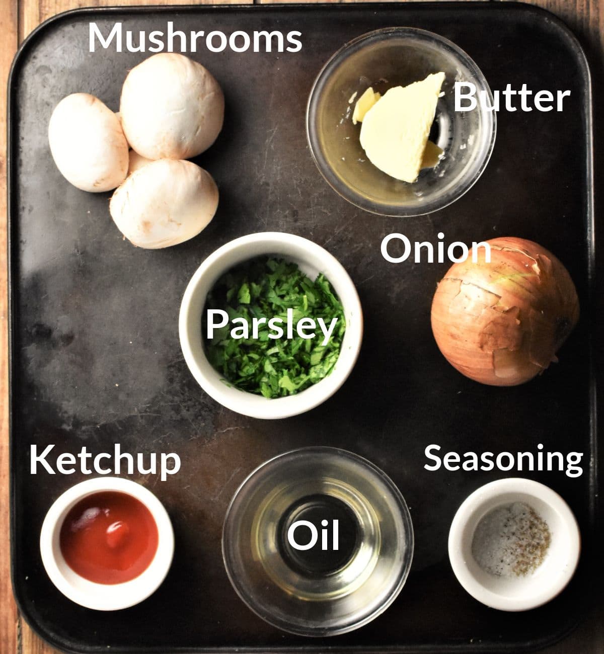 Ingredients for making mushroom crepes filling in individual dishes.