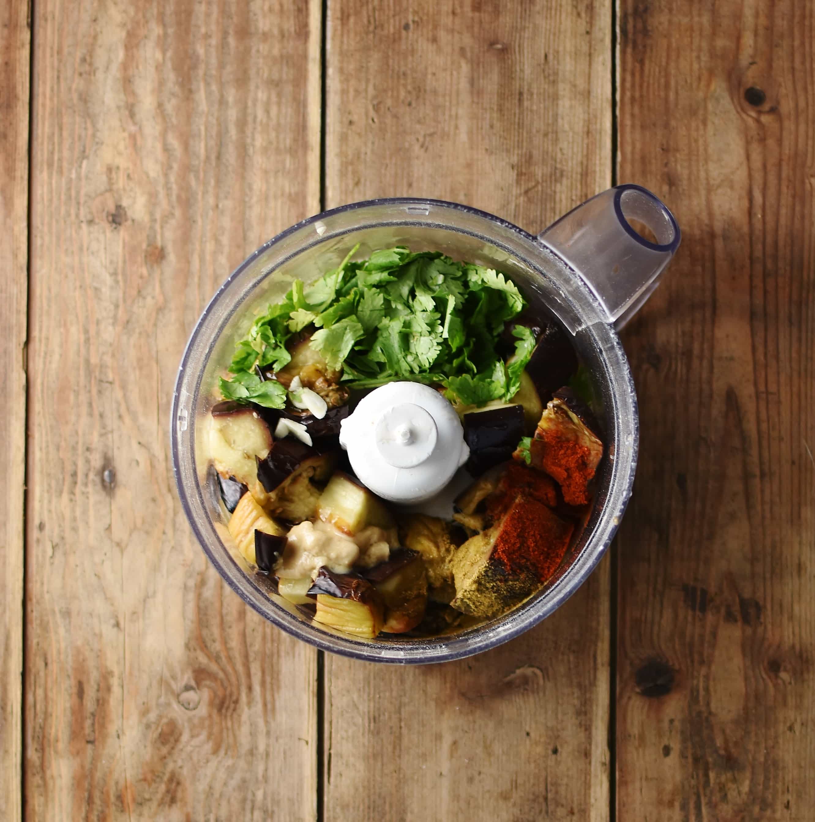 Roasted eggplant dip ingredients inside blender.