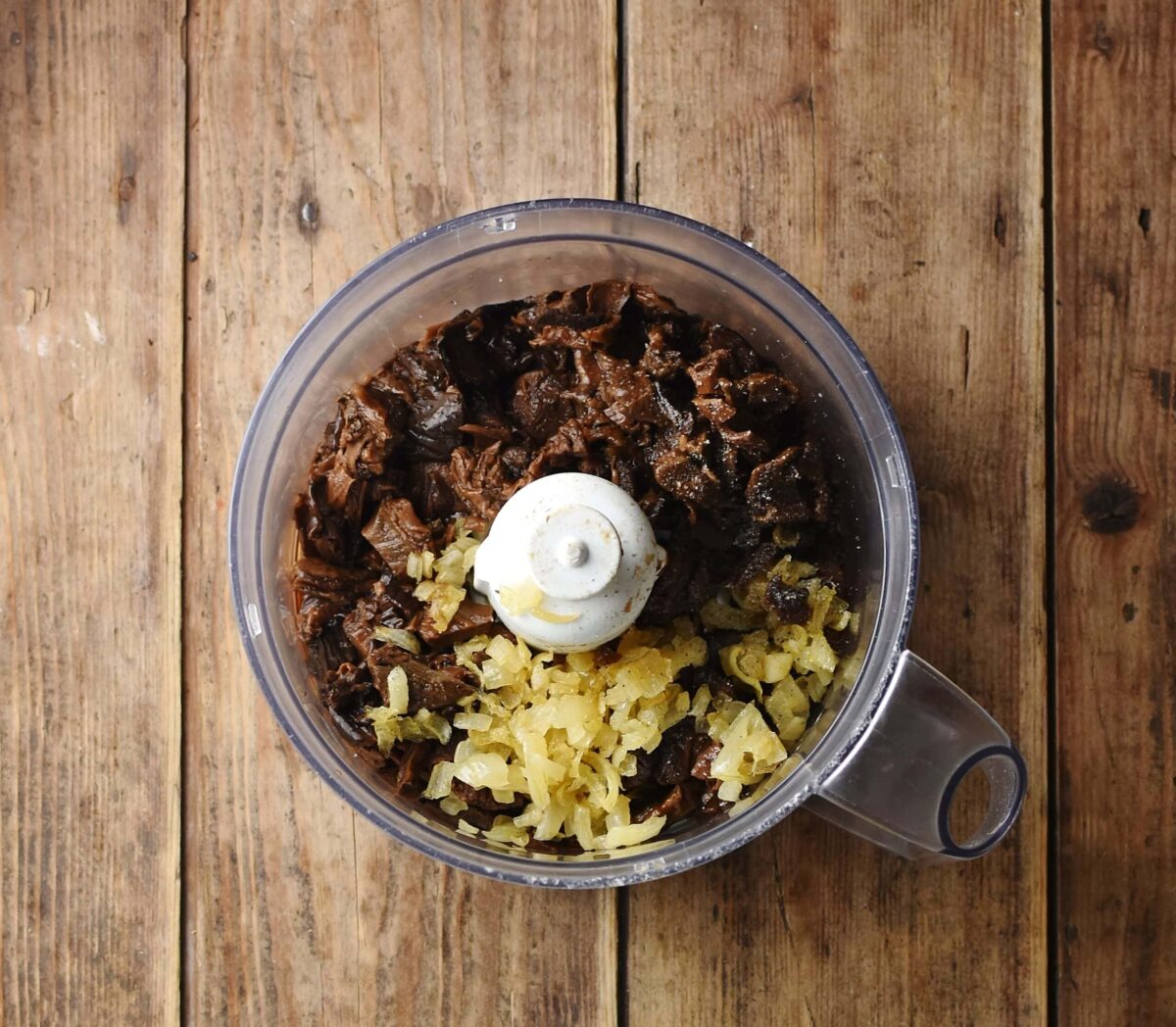 Chopped mushrooms and onions in blender.