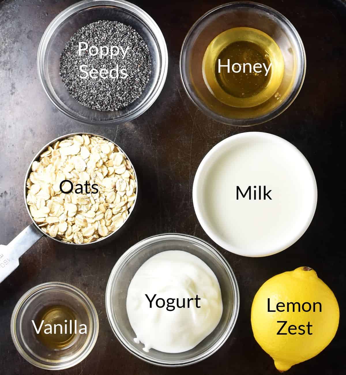 Top down view of lemon and poppy seed overnight oats ingredients in individual dishes.
