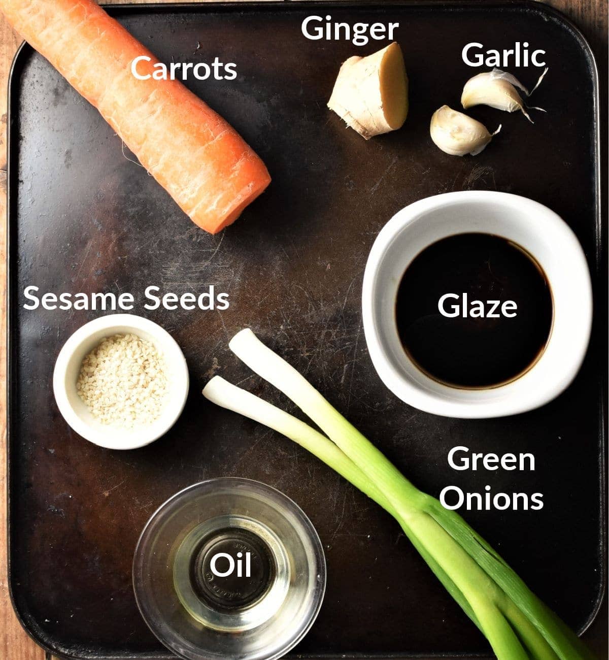 Carrot noodles stir fry ingredients in individual dishes.