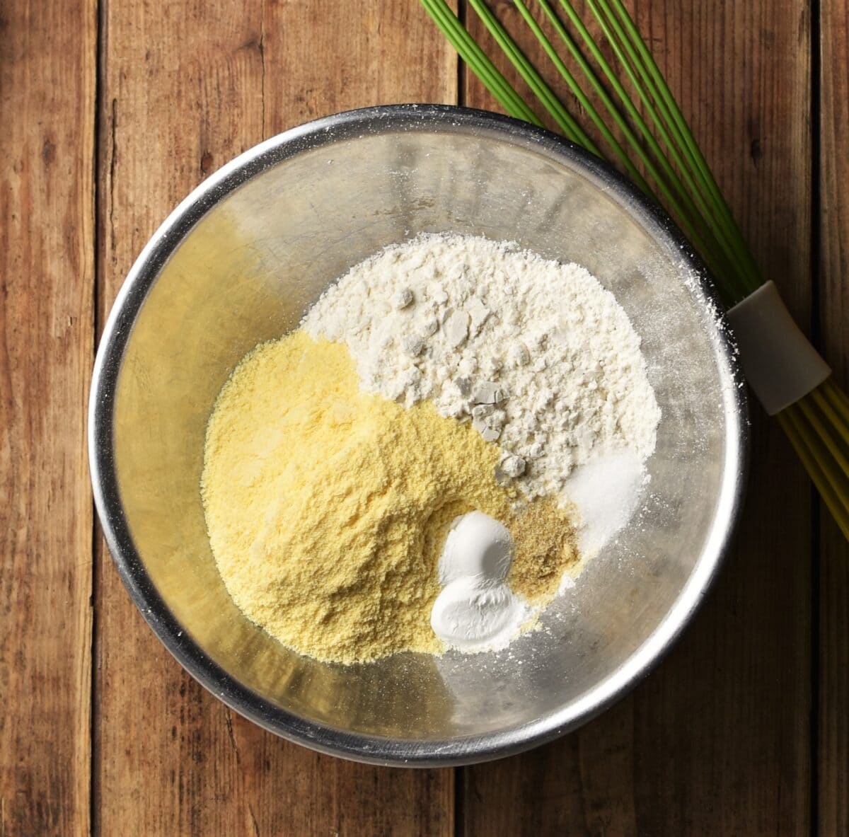 Flour and cornmeal in large metal bowl.
