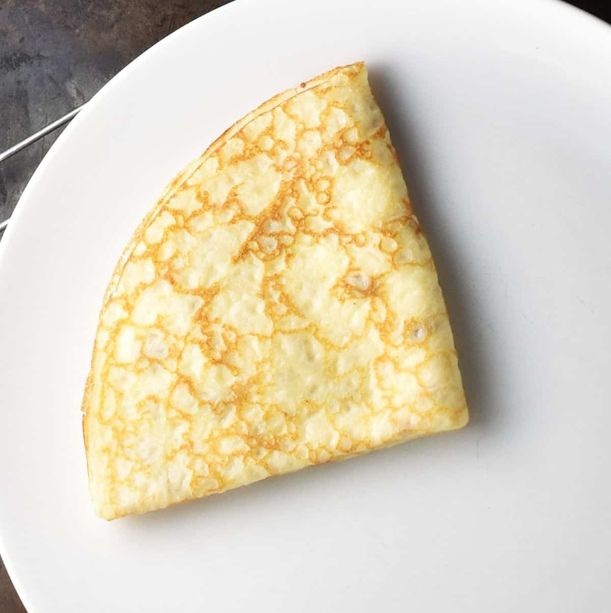 Double folded Polish crepe on white plate.