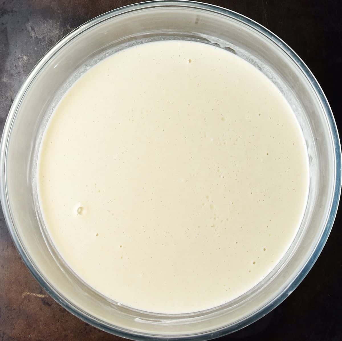 Nalesniki batter in glass bowl.