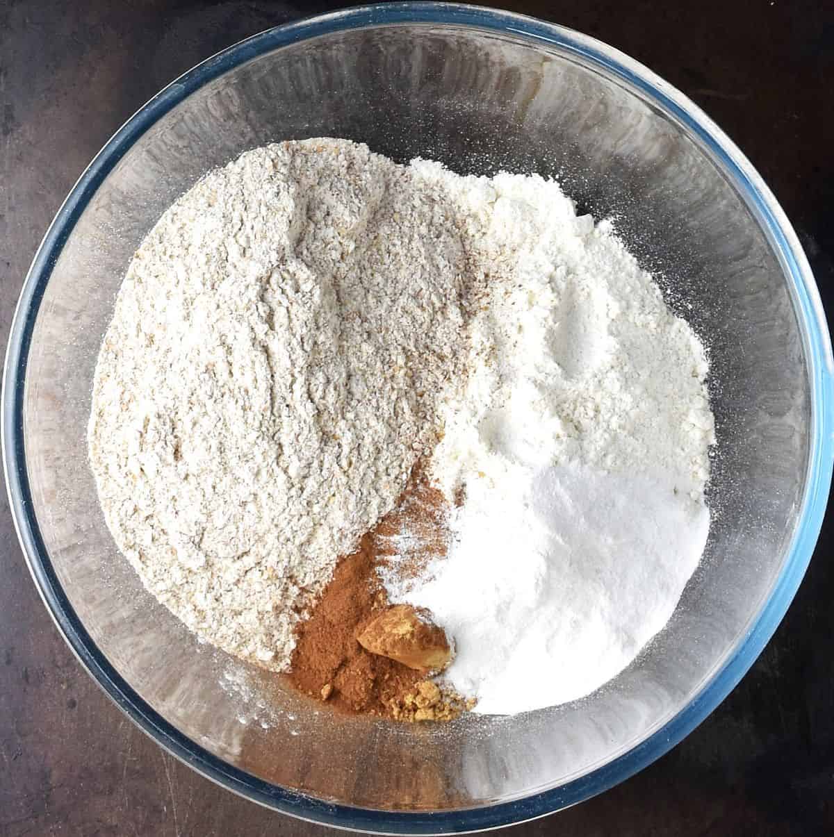Dry ingredients for muffins in large glass bowl.