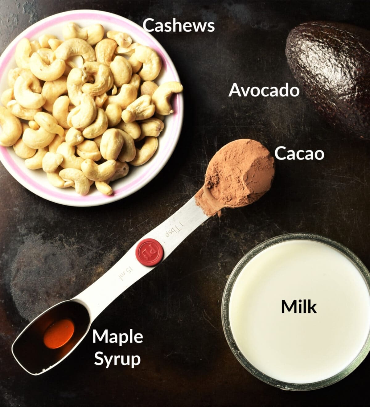 Chocolate avocado mousse ingredients in separate dishes.