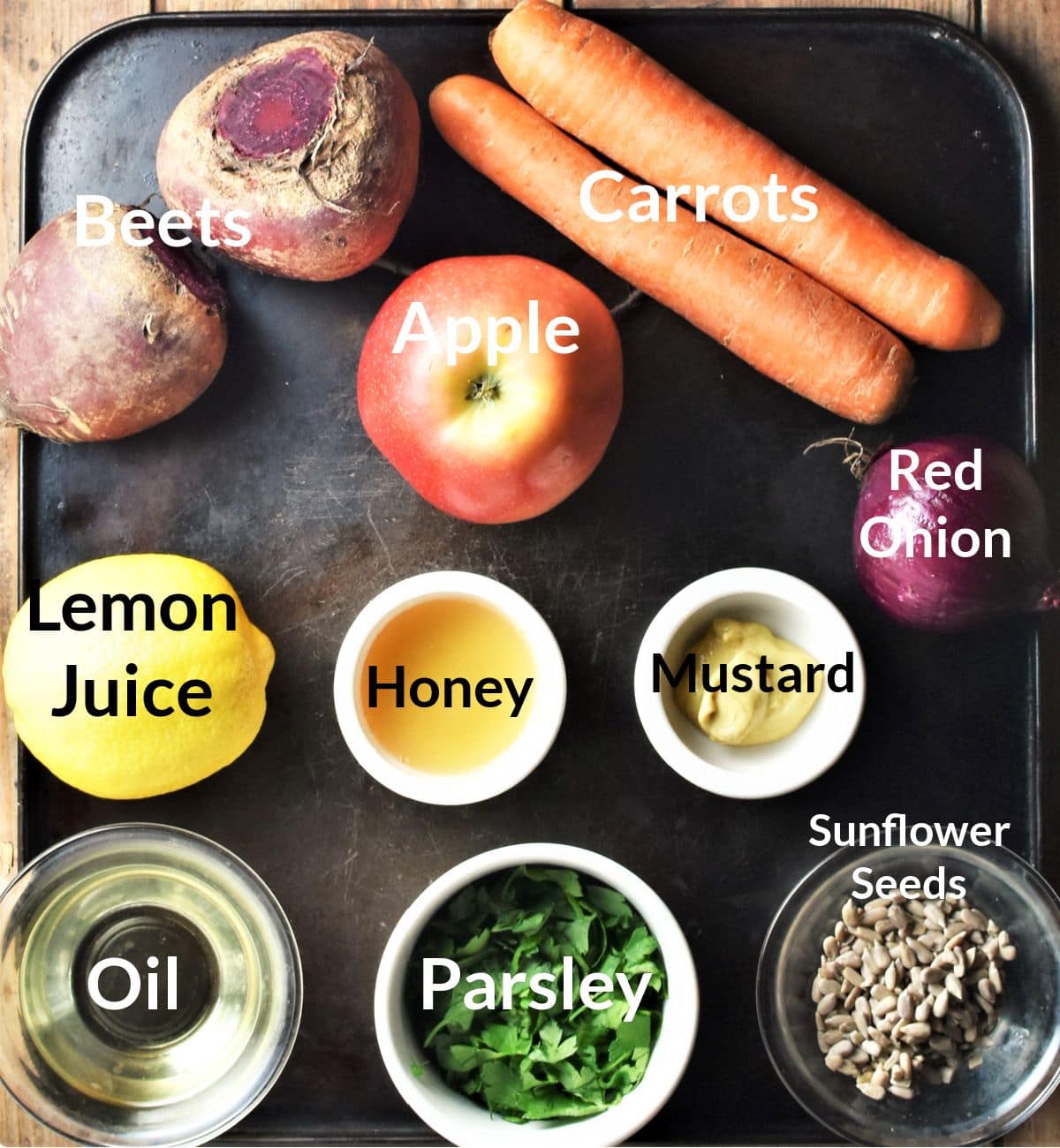 Ingredients for making beet slaw in individual dishes.