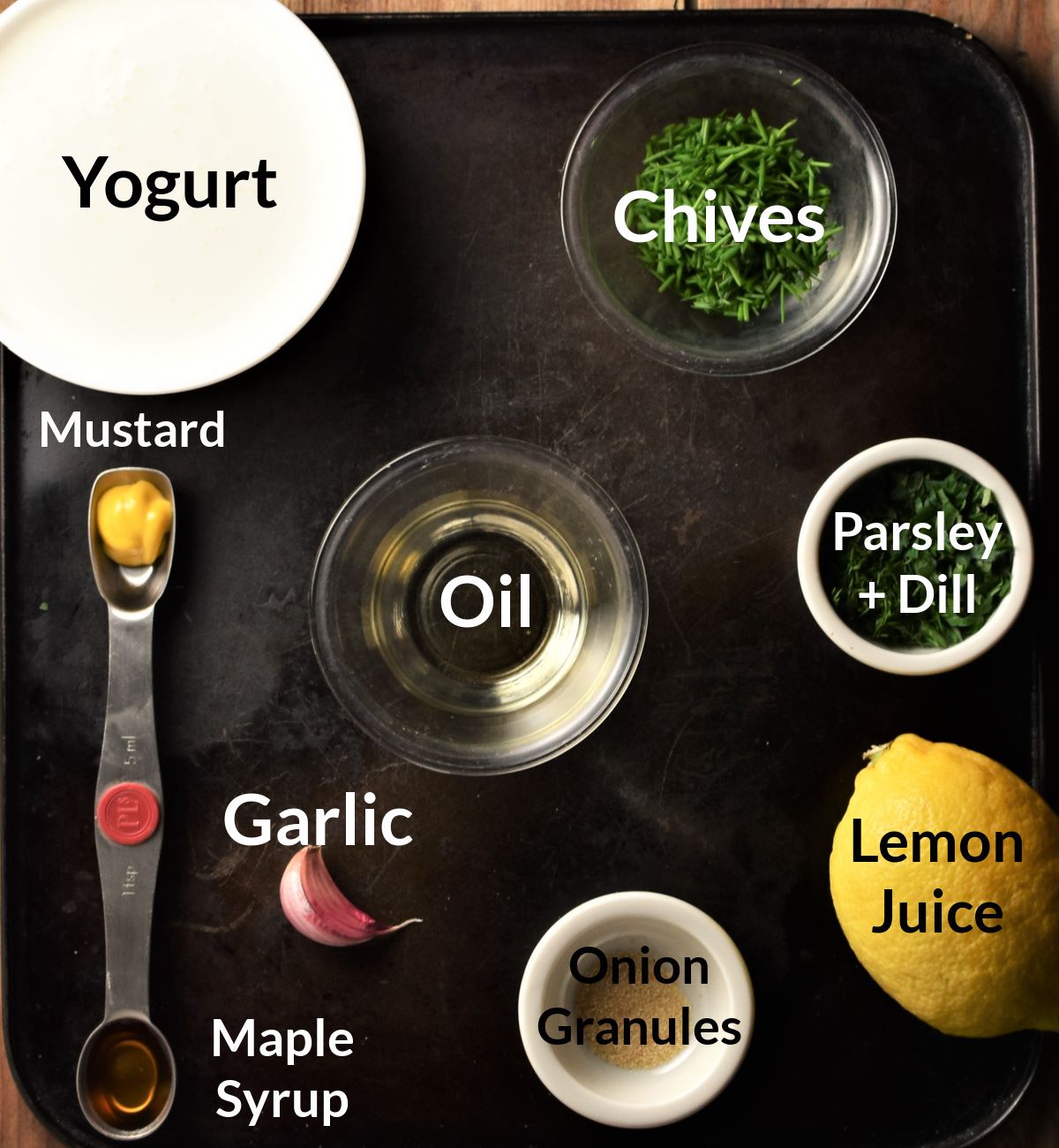 Ingredients for making healthy ranch dressing in individual dishes.