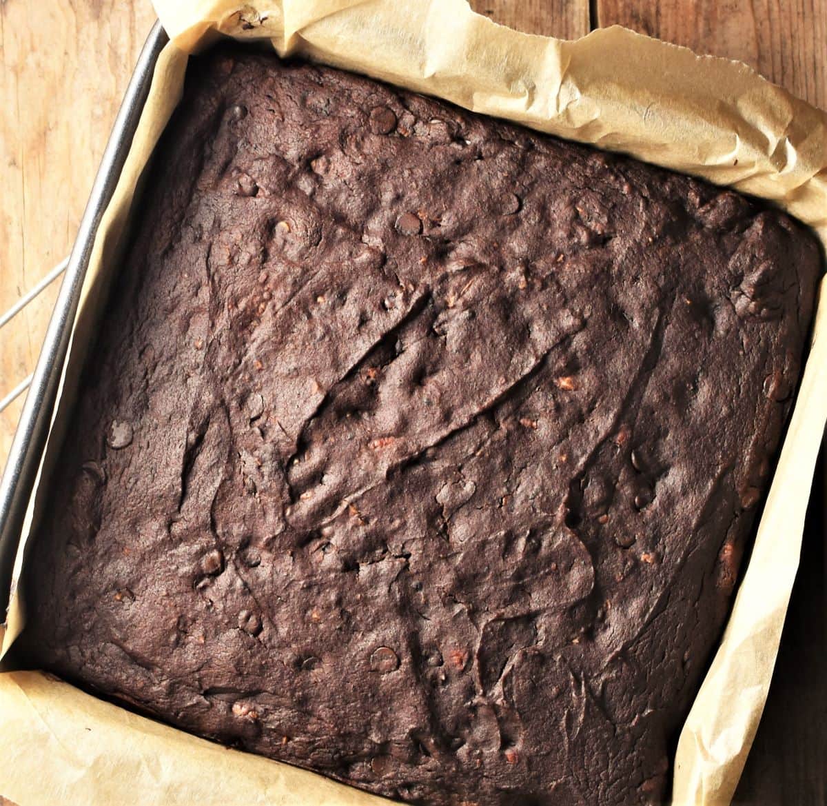 Top down view of brownie cake in square pan.