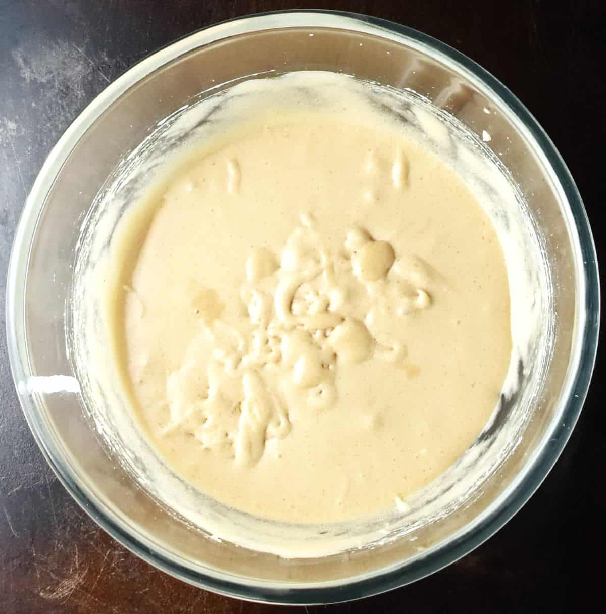 Top down view of creamy mixture for vegan pumpkin brownies.