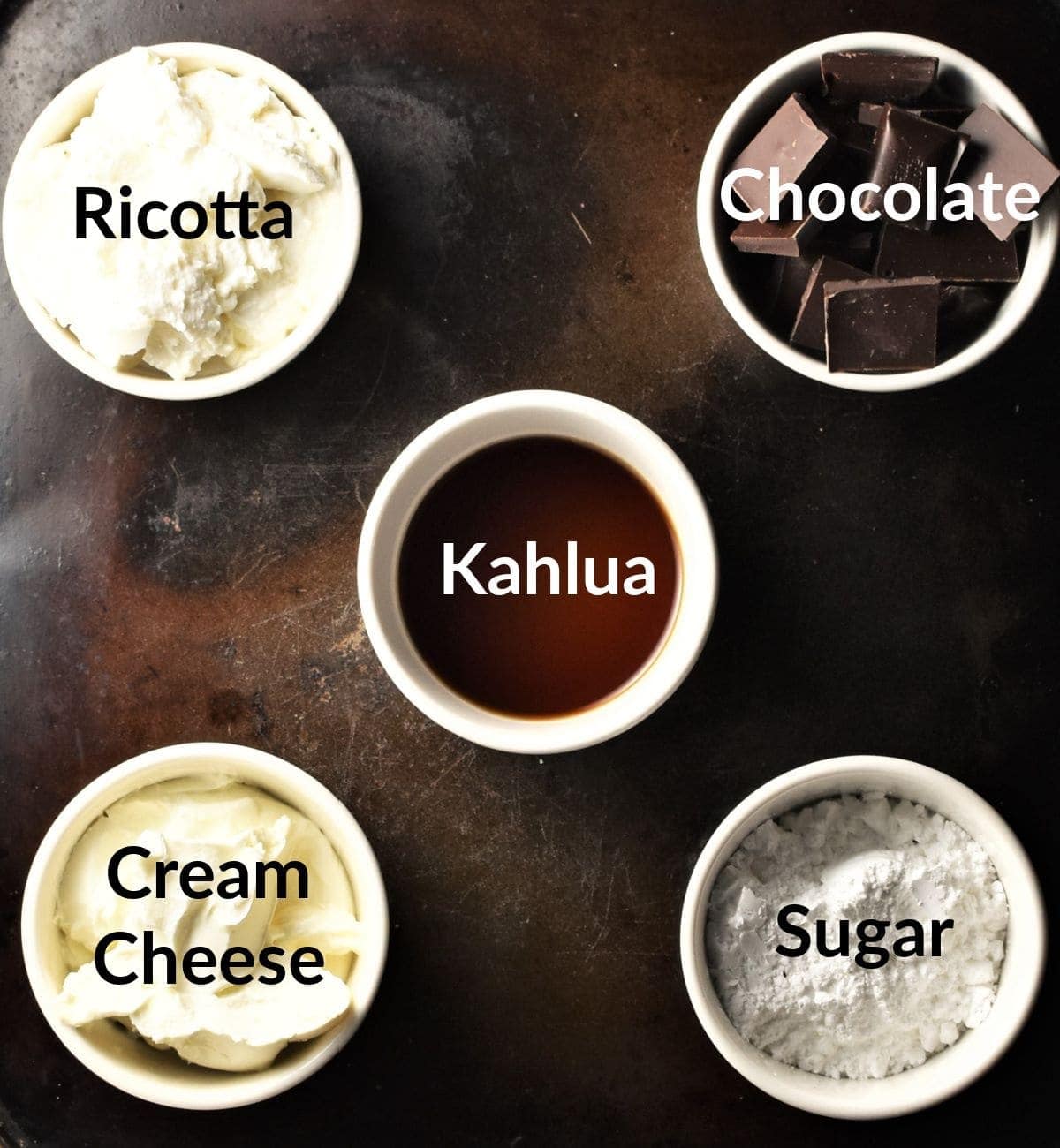 Kahlua cheesecake pots ingredients in individual dishes.