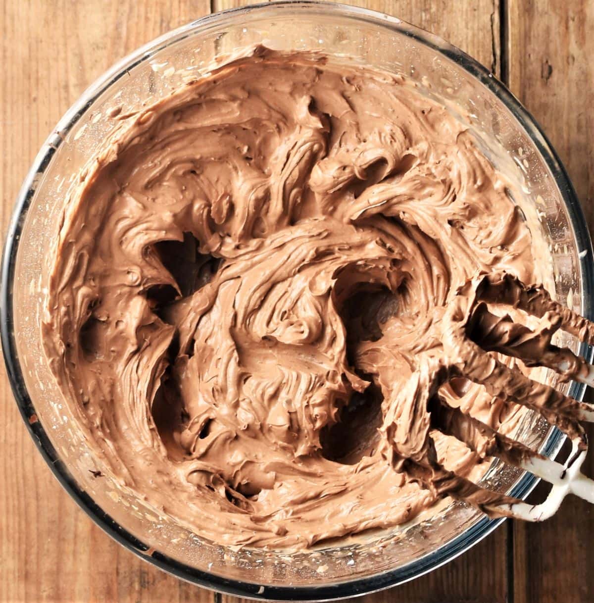 Creamy chocolate cheese mixture in bowl.