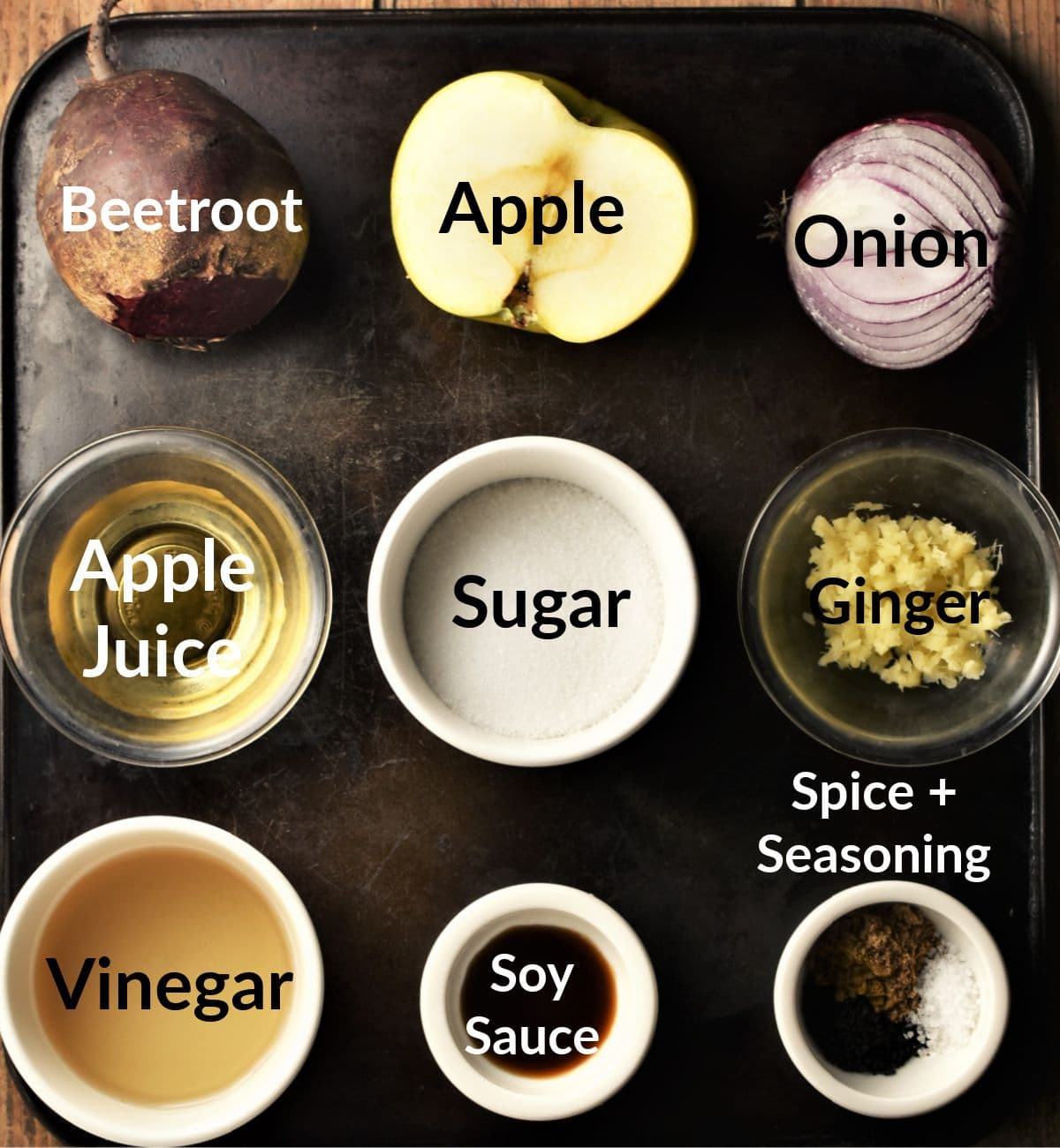 Beetroot chutney ingredients in individual dishes.