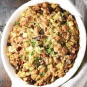 Top down view of vegan stuffing in white oval dish.