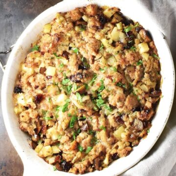 Top down view of vegan stuffing in white oval dish.