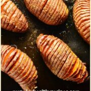 Top down view of hasselback sweet potatoes on top of shiny dark brown tray.
