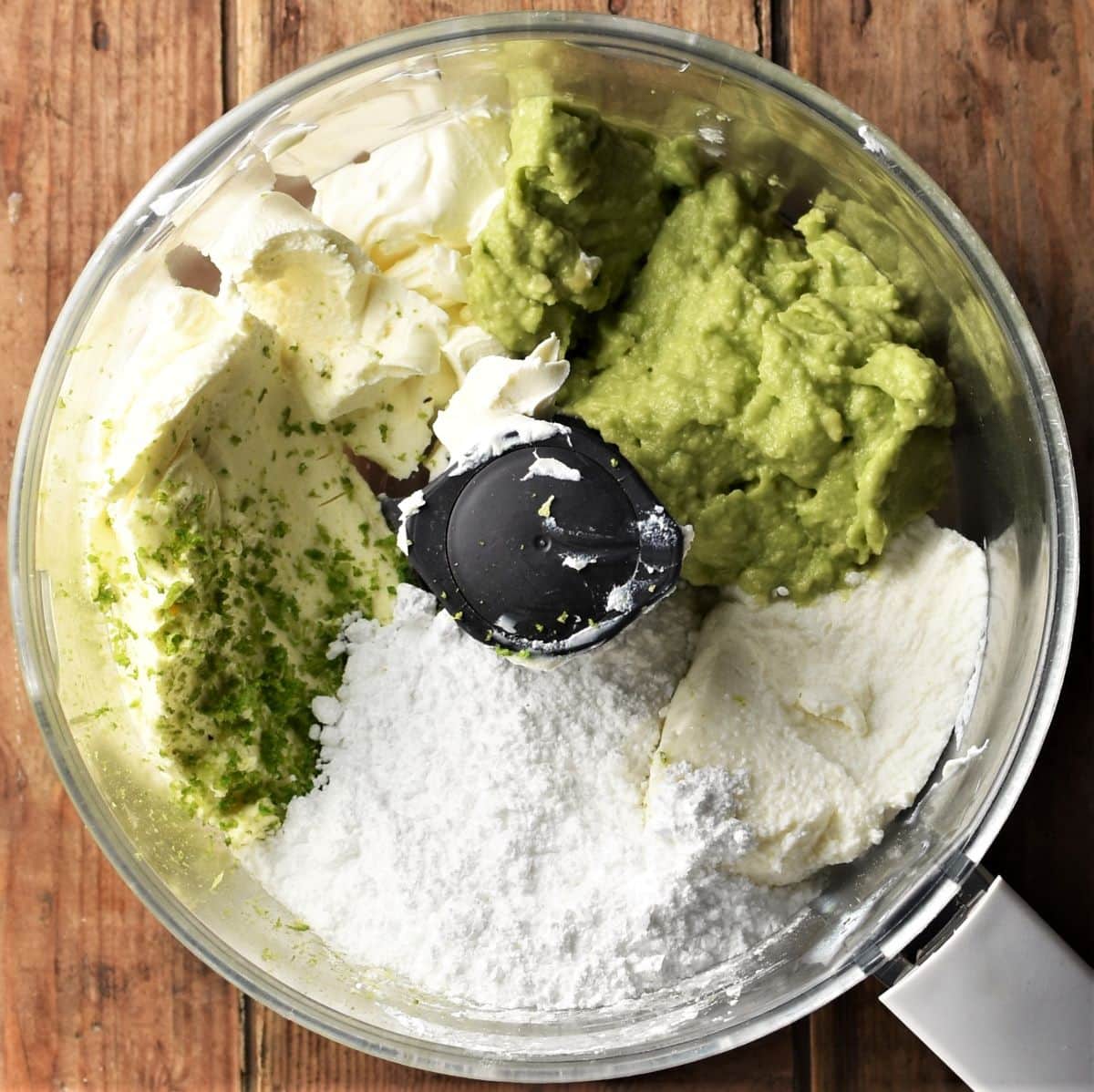 Making avocado cheesecake filling in food processor.