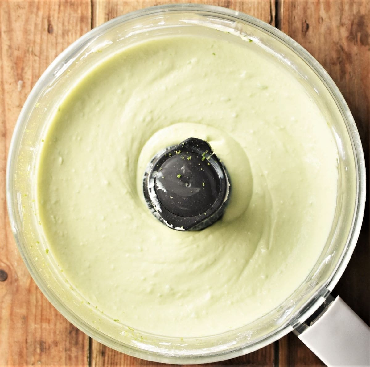 Creamy cheesecake filling mixture in blender.