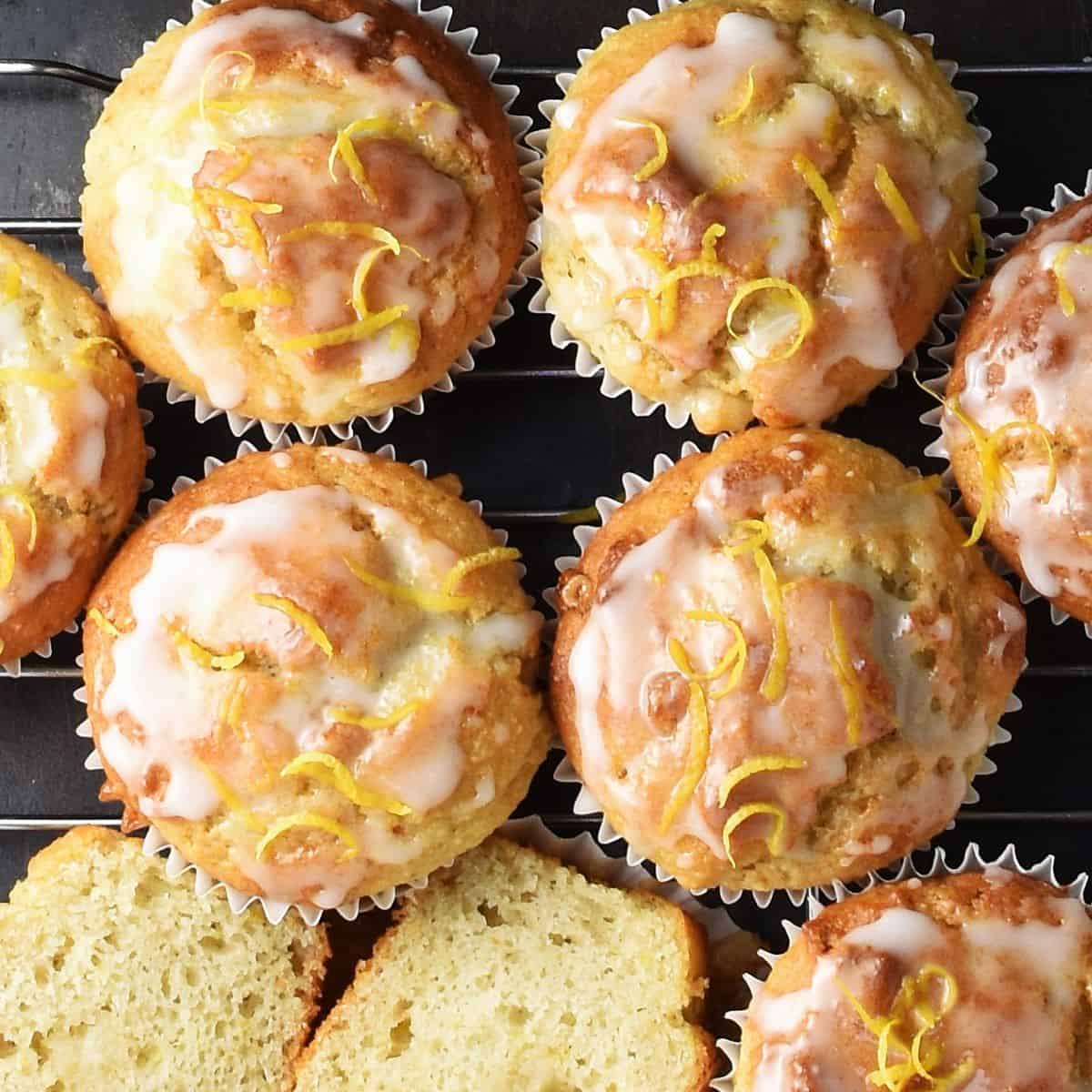 Top down view of marzipan muffins with lemon glaze close together.