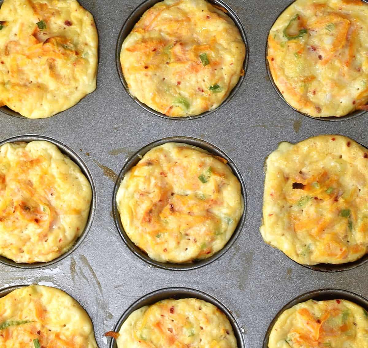 Baked sweet potato egg cups in muffin pan.