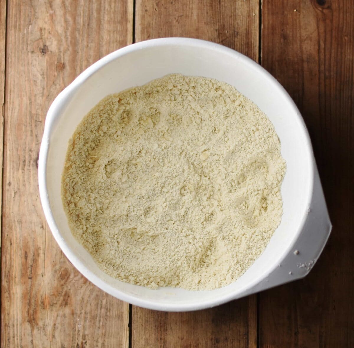 Dry mixture inside large white bowl.