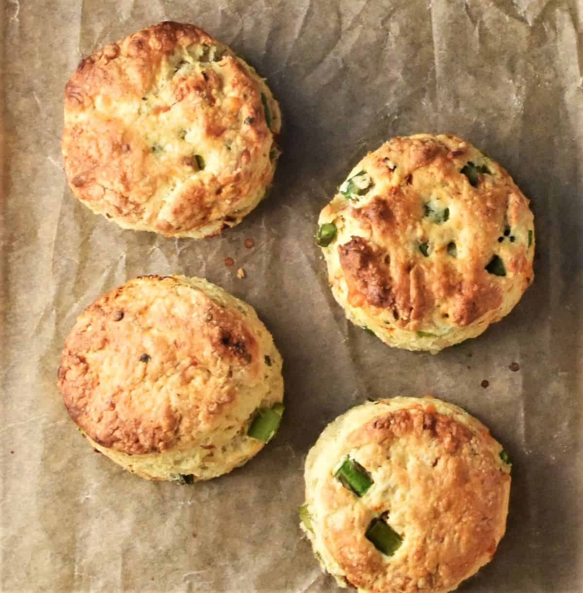 4 asparagus scones on top of parchment.