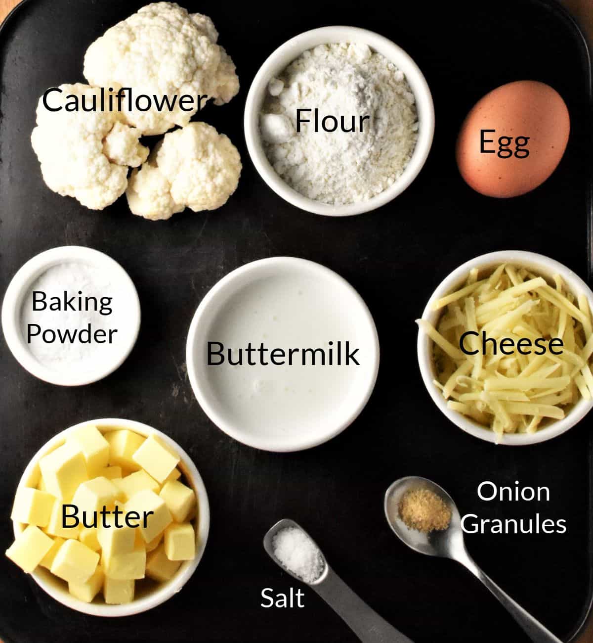 Ingredients for making cauliflower scones in individual dishes.