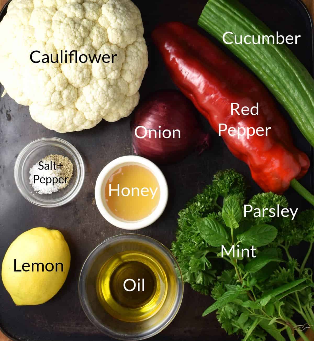 Ingredients for making cauliflower tabbouleh in individual dishes.
