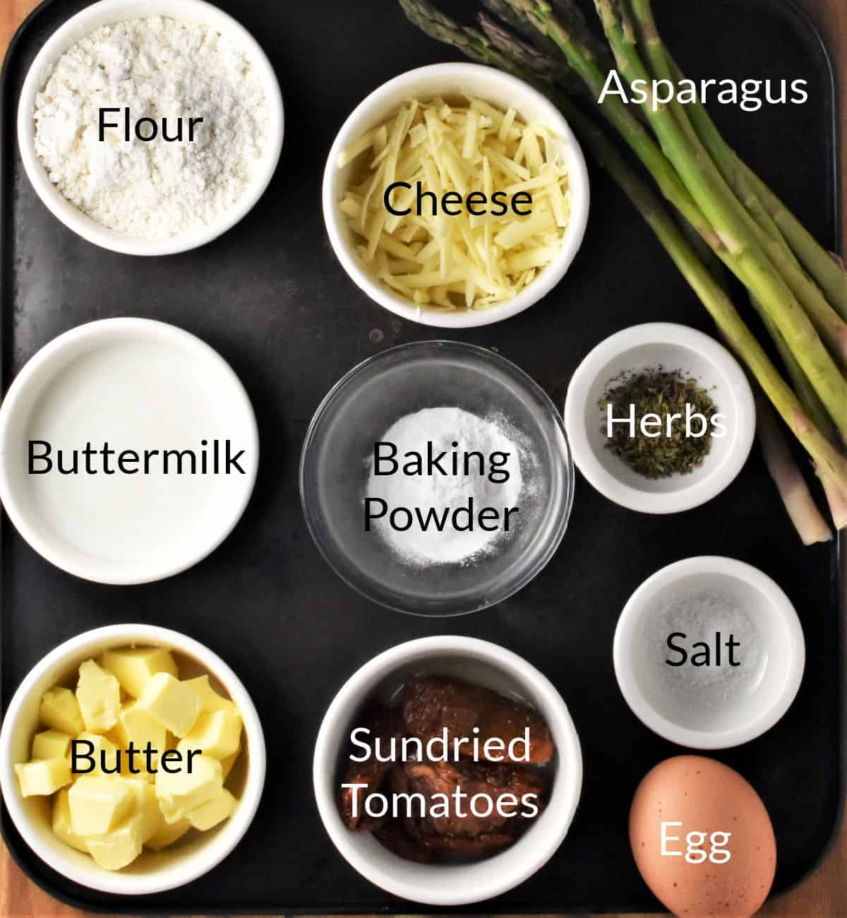 Ingredients for making sun dried tomato scones in individual dishes.