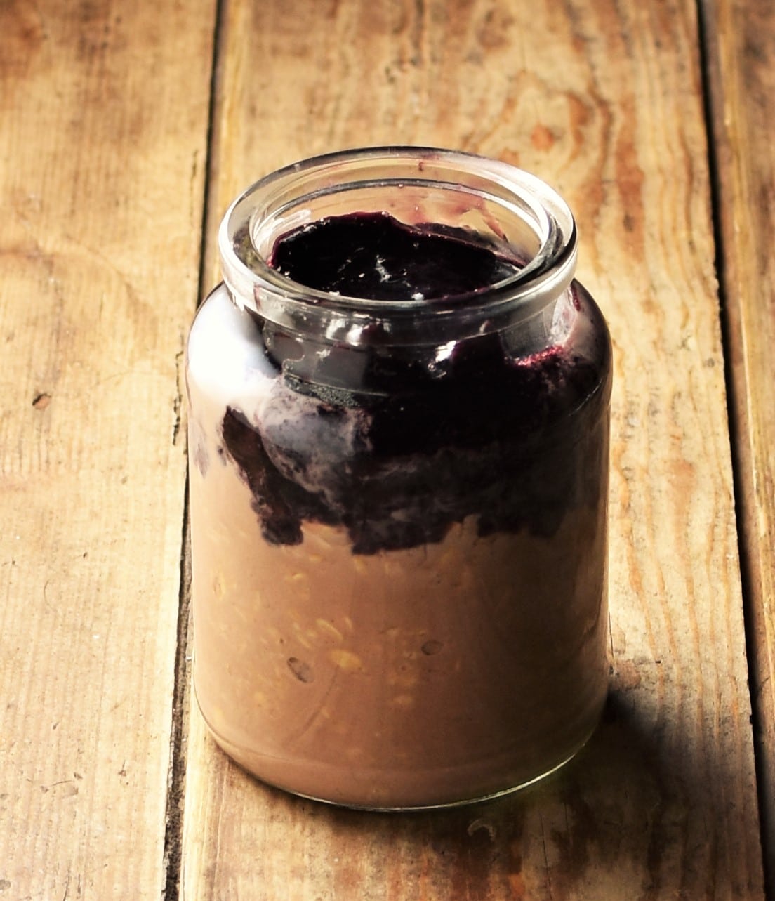 Cherry cocoa overnight oats in jar.