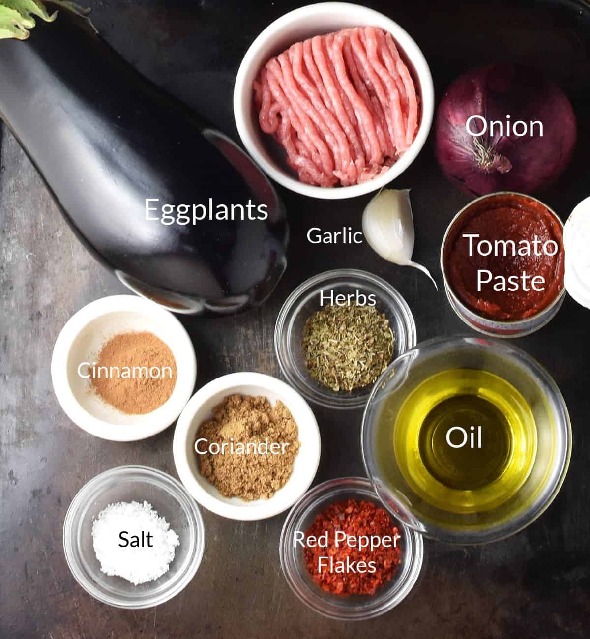 Ingredients for making ground turkey eggplant recipe in individual dishes.