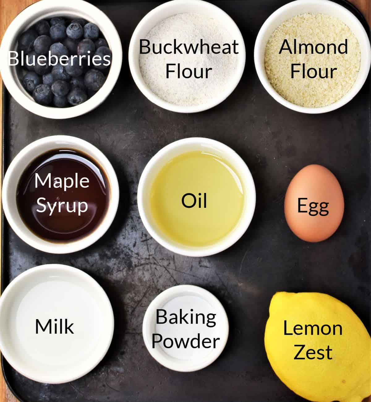 Ingredients for making blueberry buckwheat muffins in individual dishes.