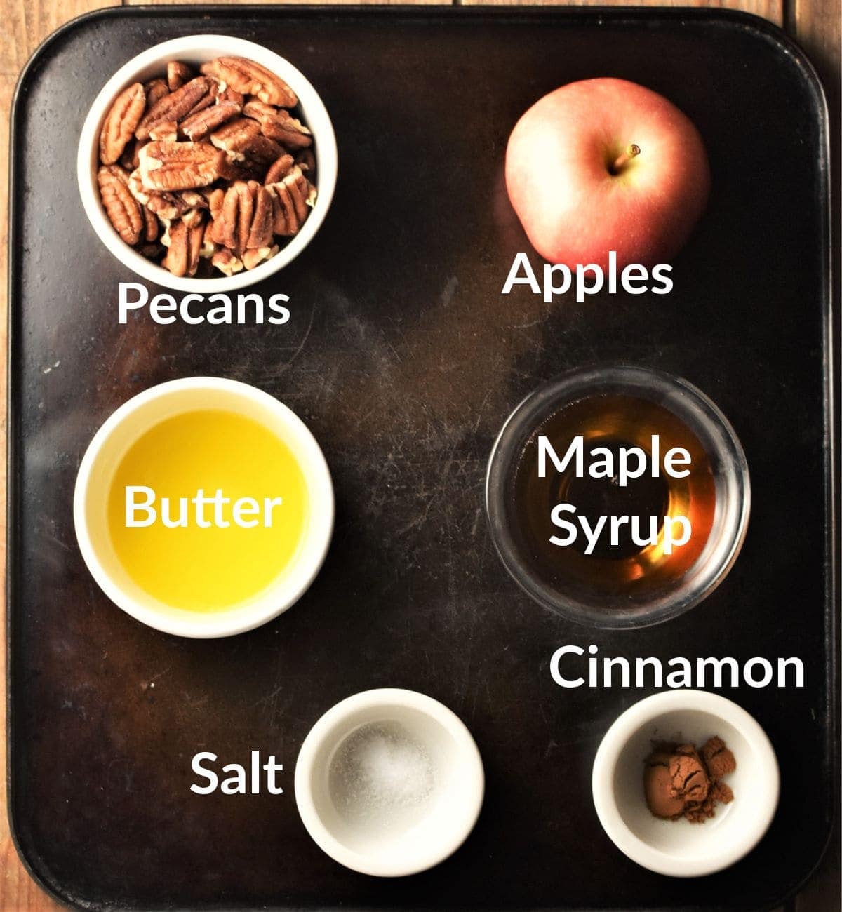 Healthy baked apples ingredients in individual dishes.