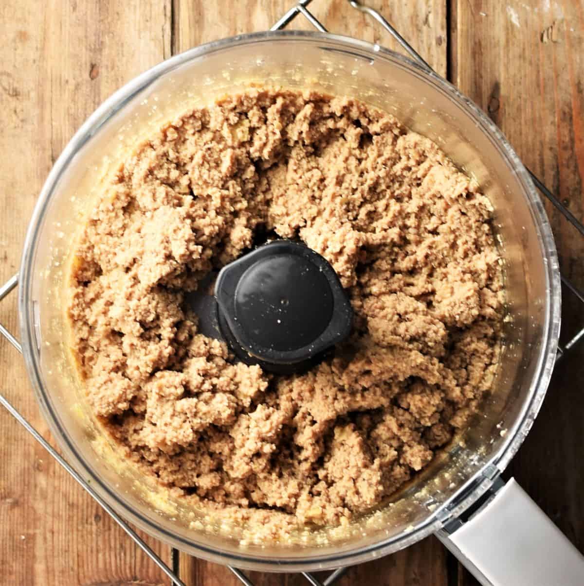 Filling mixture for pierogi with meat in food processor.