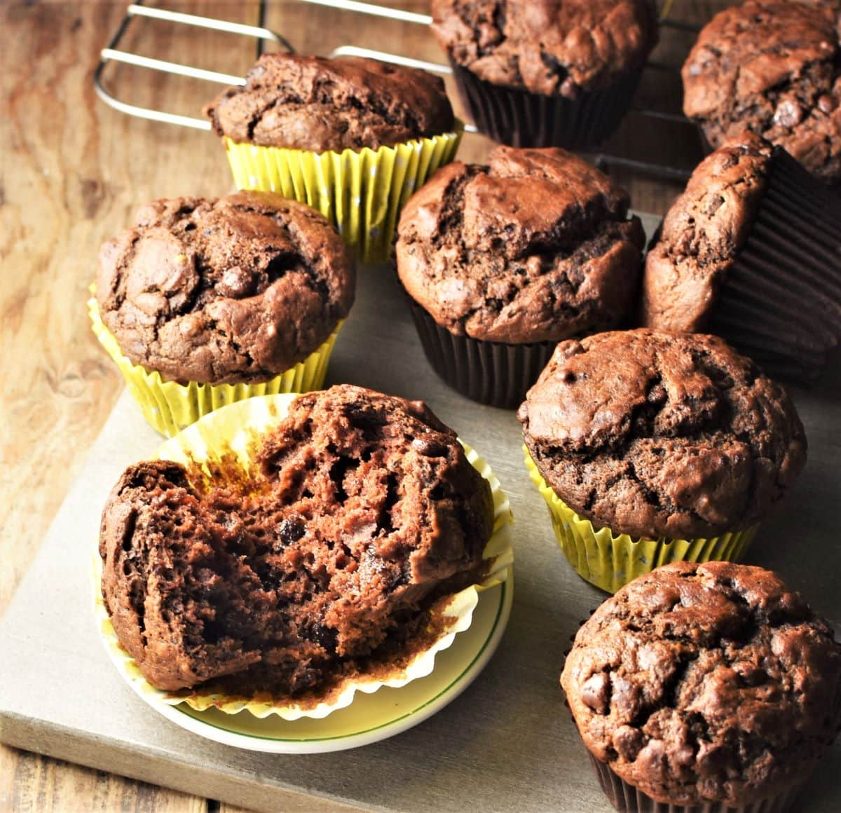 Side view of pumpkin chocolate muffins in yellow liners.